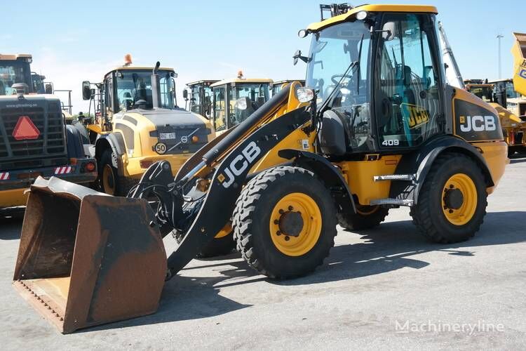 جرافة ذات عجلات JCB 409 * Ny renoverad motor *